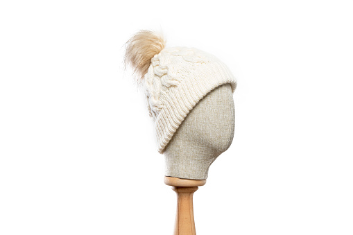 White knit hat/beanie with mannequin head on white background