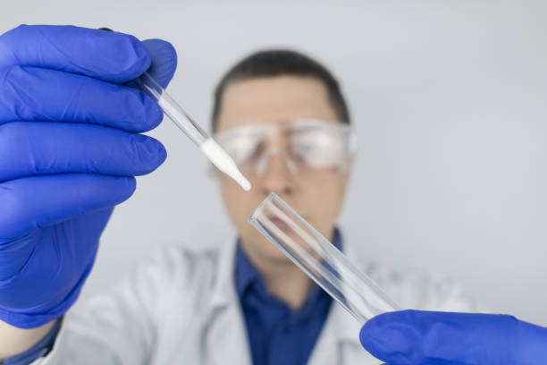 Semen in a test tube. Reproductive system check. Donor suitability test for artificial insemination. Medical laboratory assistant checks a test tube with sperm. Spermogram. Male fertility test. el asistente de laboratorio médico revisa un tubo de ensayo con esperma. espermograma. prueba de fertilidad masculina. semen en un tubo de ensayo. comprobación del sistema reproductivo. prueba de idoneidad del donante para la inseminación artificial