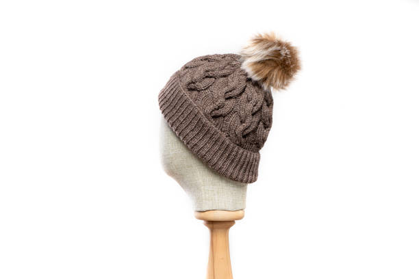 istock Brown  knit beanie with mannequin head on white background 1395499470