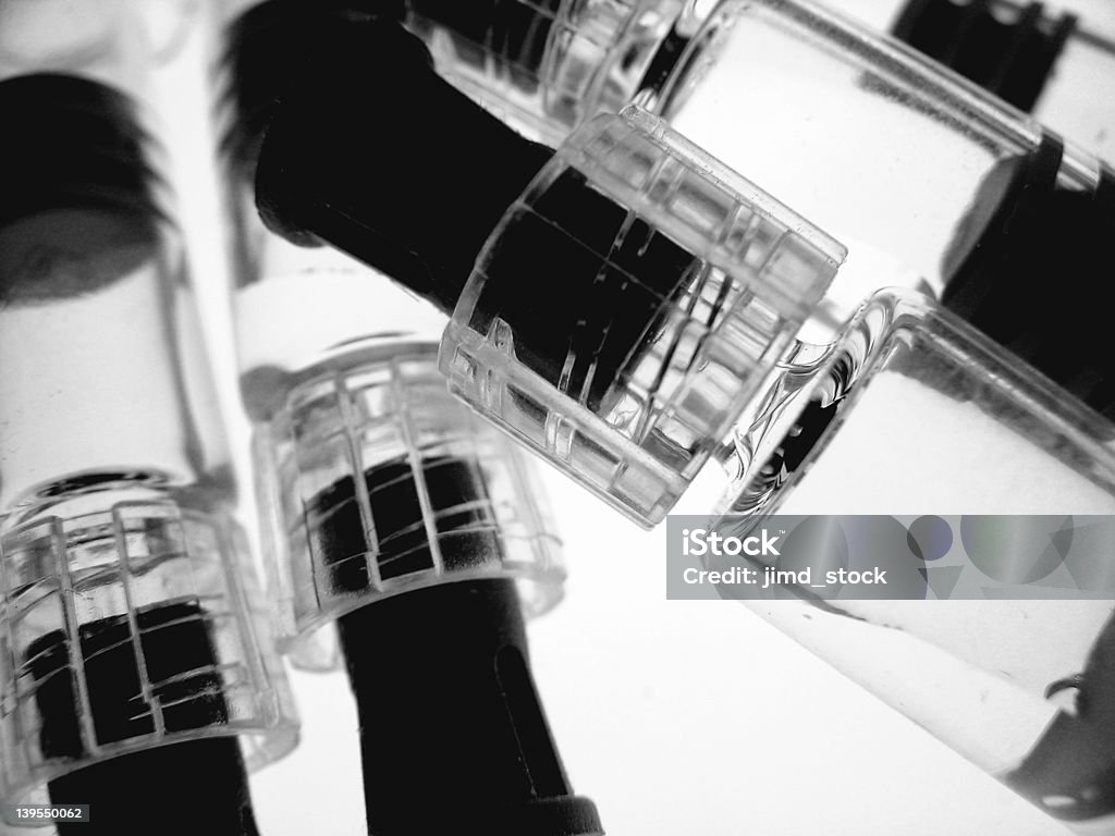 Syringe Group BW Group of medical syringes (vaccine) backlit/isolated. Black & White AIDS Stock Photo