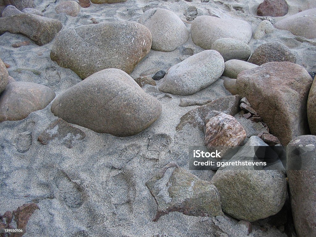 Große Kiesel auf einem Sandstrand - Lizenzfrei Bunt - Farbton Stock-Foto