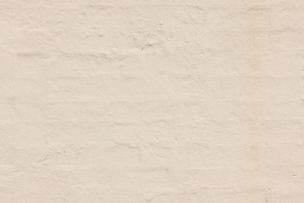 Close-up on an old painted brick wall.