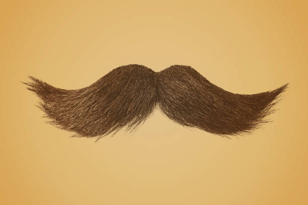 istock Curly moustache on a retro sepia colored background 1395507987