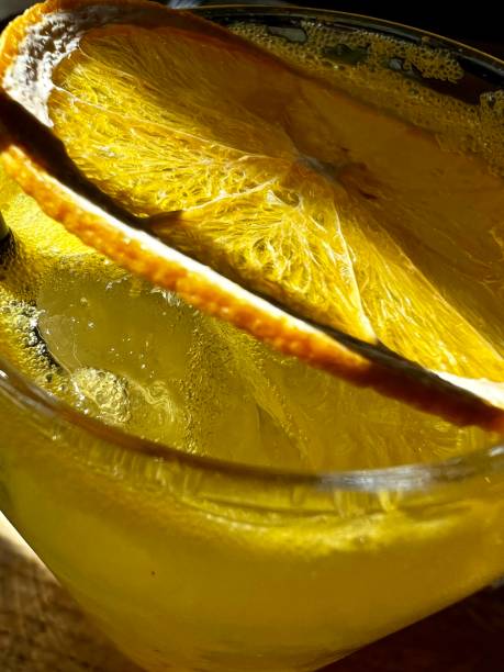 istock lemonade with slice of orange close-up 1395513562
