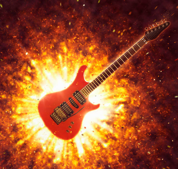 istock Red rock electric guitar against dramatic explosion 1395513590