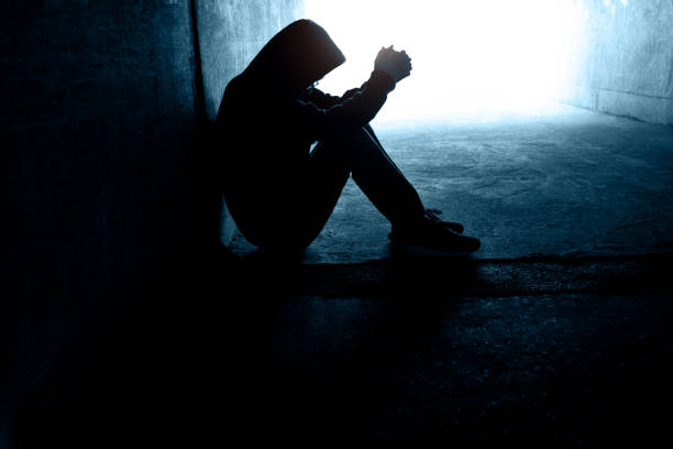 istock One man sitting in the dark tunnel 1395514997