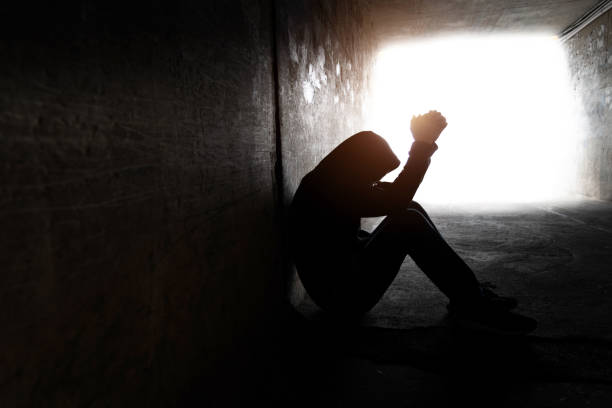 istock One man sitting in the dark tunnel 1395514998