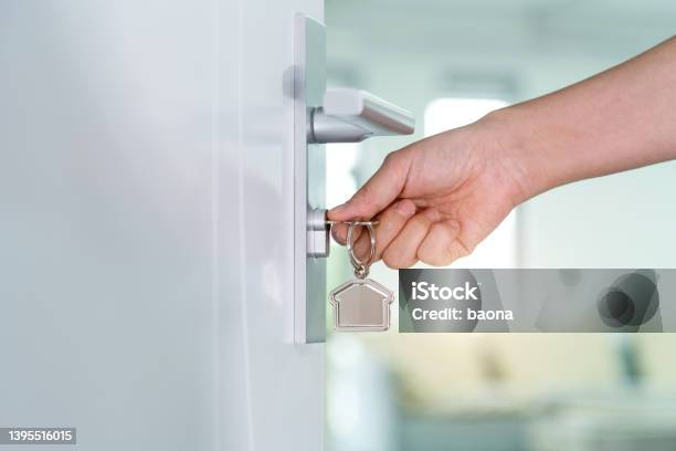 Human Hand Opening A Door With Key Stock Photo - Download Image Now - Door, Key, Home Ownership