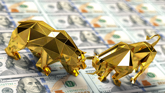 Golden Bull Market and Bear Market Sign Battle on US Dollar Banknotes. 3D Render