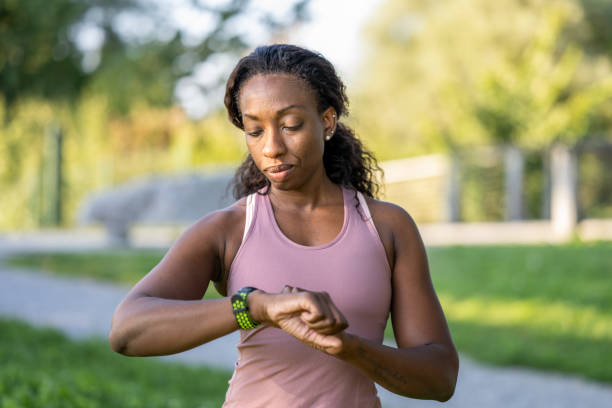 istock Woman looking watch 1395516348