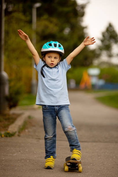 istock Little boy, riding skateboard in the park 1395516486