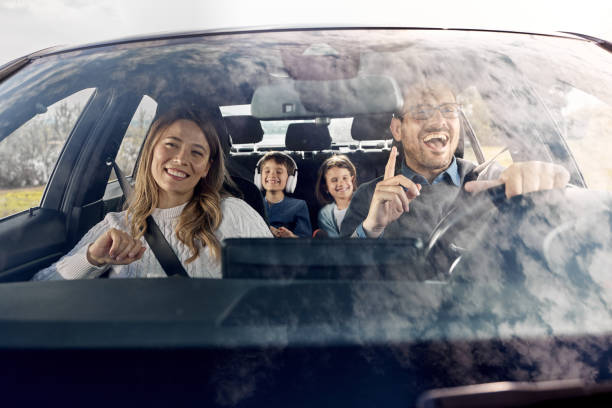 istock Happy family going on a vacation by car. 1395517550