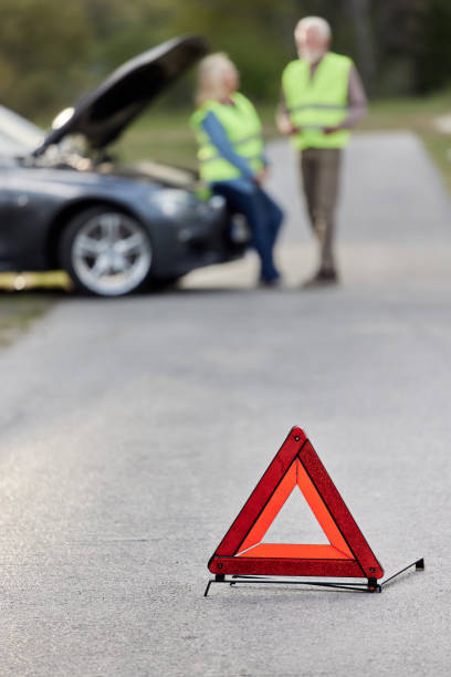istock Portable warning triangle on the street. 1395517729