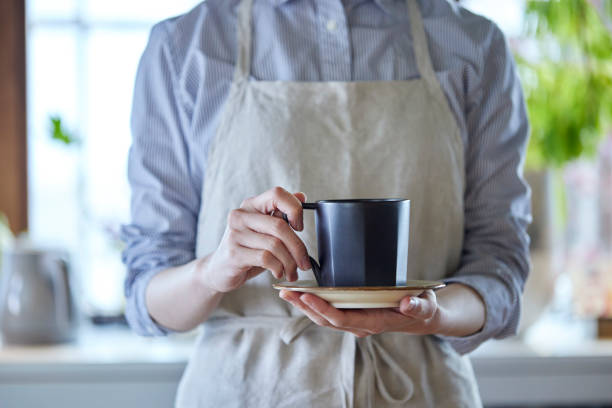 istock Young Japanese woman carrying coffee 1395522083