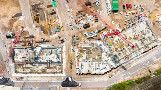 istock Large construction site, cranes and equipment - aerial view 1395526918