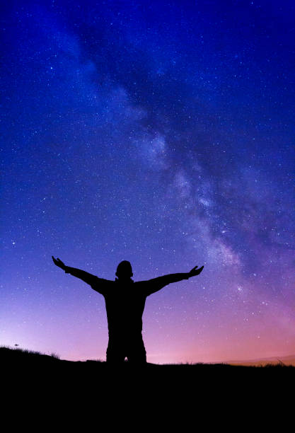 istock Man enjoying Milky Way 1395527108