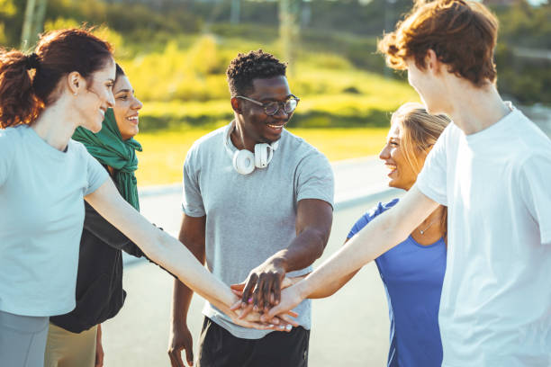 istock Motivated athletes high fiving after successful workout 1395530904