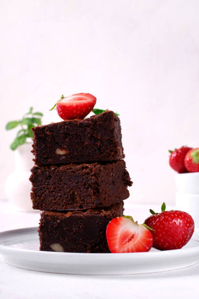 istock Brownie with nuts and strawberry 1395534360