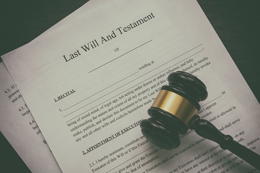 Lawyer working at table in office, selective focus