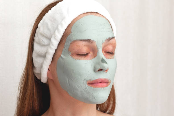 istock Woman with blue dry clay mask on face 1395535375