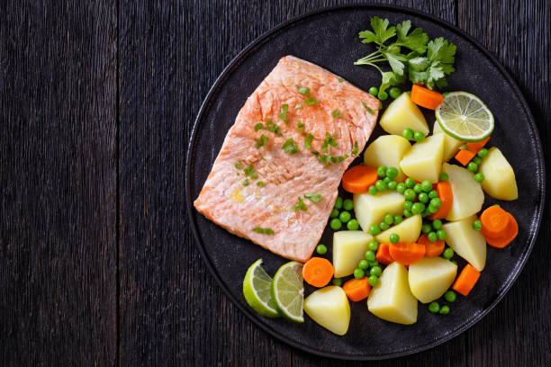 istock Multi Cooker salmon, carrots, peas and potatoes 1395535505