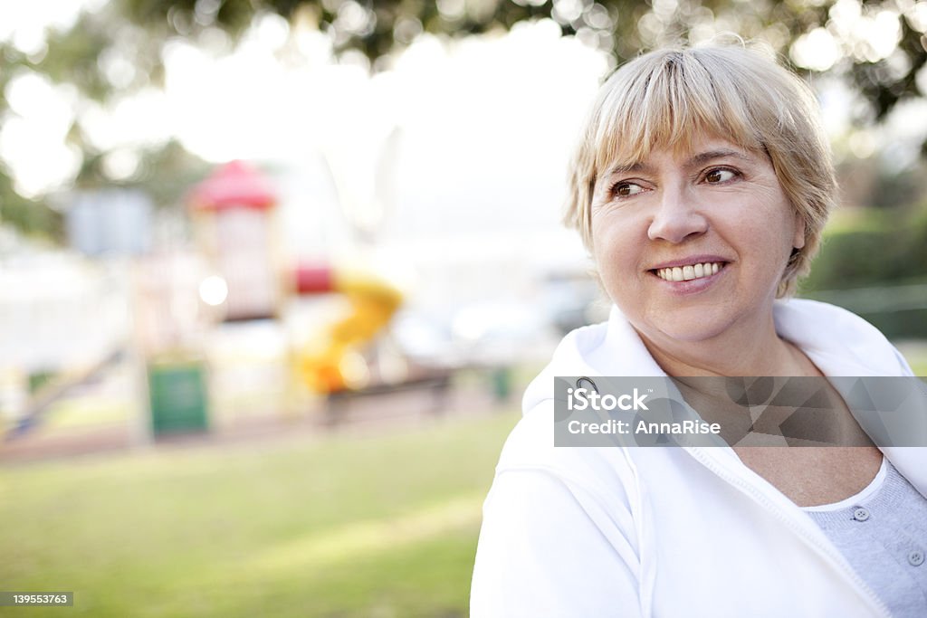 Sweet Nostalgia Happy Senior Woman at Playground Candid Stock Photo