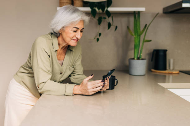 istock Mature woman taking a video call at home 1395537687