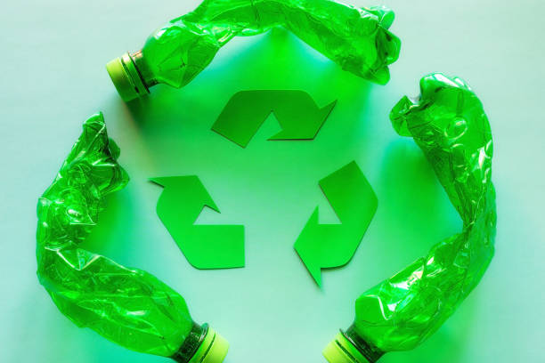 istock recycling symbol and used plastic bottles environmental pollution concept 1395538804