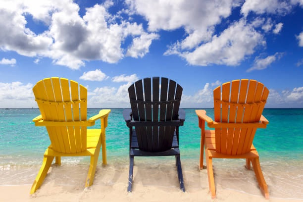 istock Three colorful beach chairs on Caribbean coast 1395542396