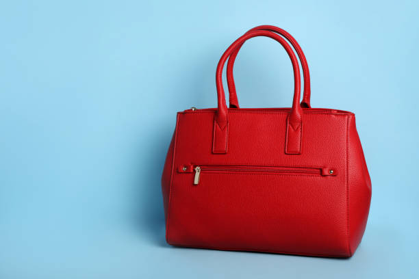 istock Stylish woman's bag on light blue background. Space for text 1395543293