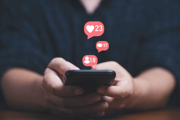 istock Man using smartphone with social media icon include like , message and human contact for online marketing technology and contact concept. 1395544709