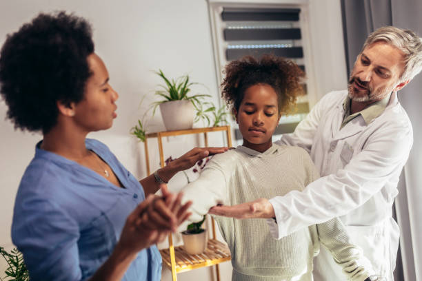 istock Physical therapy for children. Bad posture correction. 1395547379