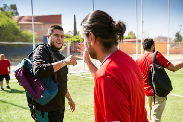 istock Soccer players greeting team mates 1395551133
