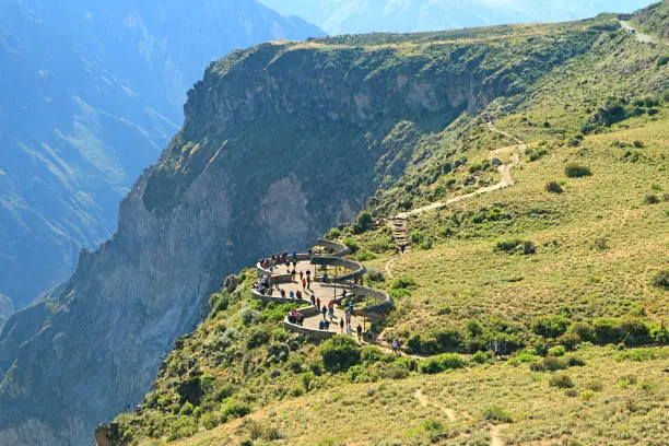 Photo of Group of Visitors Watching the Andean Condors from the Viewing Balcony of Colca Canyon, Arequipa, Peru, South America