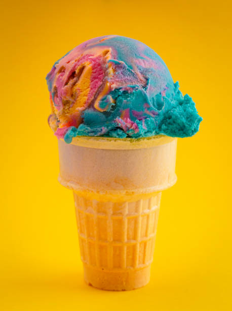 istock Scoop of Unicorn Colored Ice Cream in a Cone 1395557986