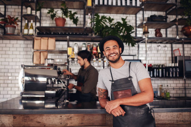 istock Coffee shop worker smiling to camera 1395559241