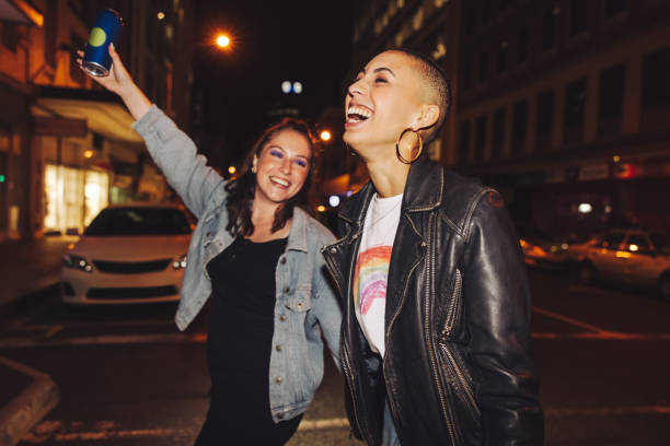 istock Two young city friends having fun at night 1395559403