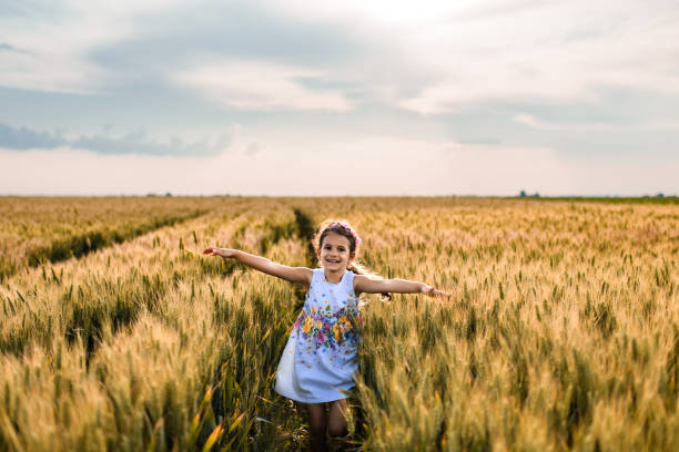 istock Happy girl enjoying nature 1395560010
