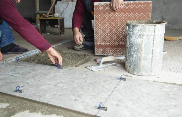 istock Laying floor ceramic tile. Renovating the floor 1395564879