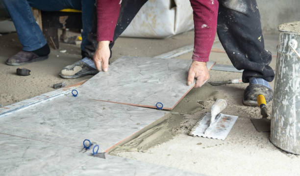 istock Laying floor ceramic tile. Renovating the floor 1395564880