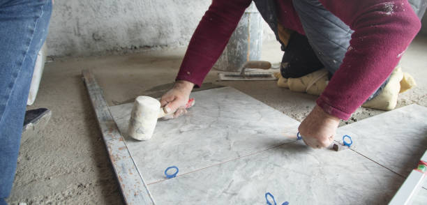 istock Laying floor ceramic tile. Renovating the floor 1395564885