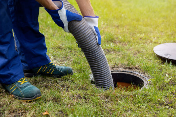 pumping out household septic tank. drain and sewage cleaning service stock photo