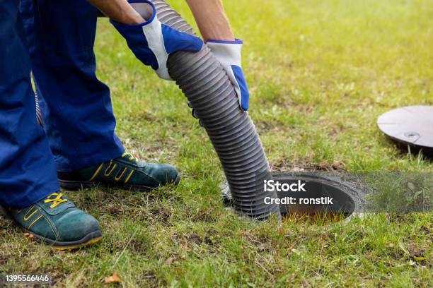 Pumping Out Household Septic Tank Drain And Sewage Cleaning Service Stock Photo - Download Image Now