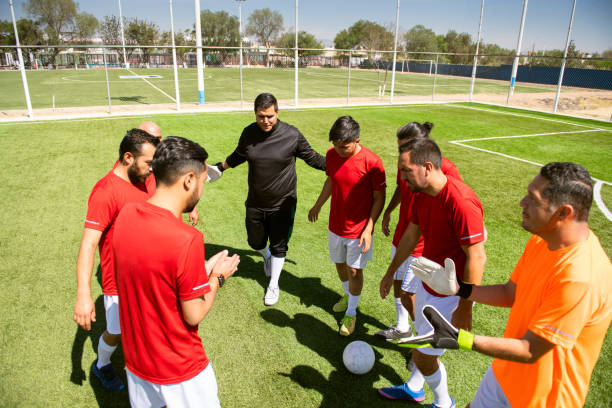 istock Soccer team huddling 1395567812