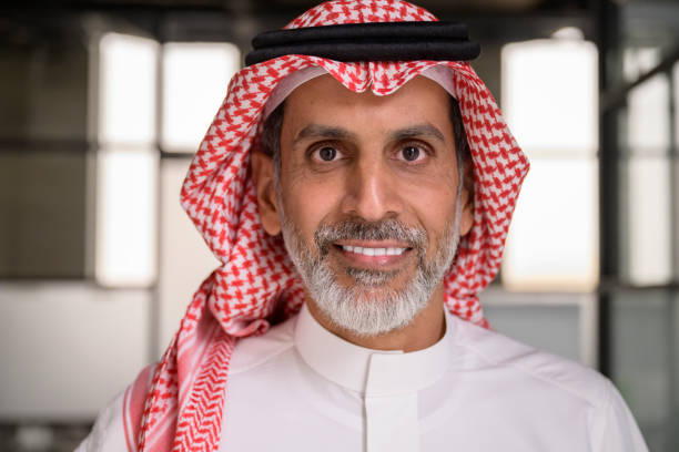 istock Headshot of cheerful Middle Eastern executive in office 1395570254
