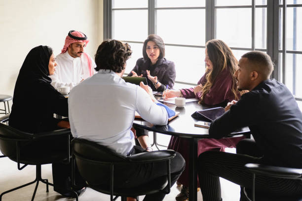istock Middle Eastern group discussing plans for new business 1395570257