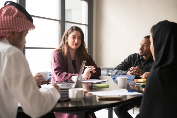 istock Idea-sharing between members of Riyadh business team 1395570266
