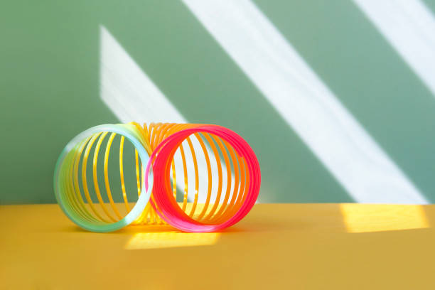 istock Rainbow toy spiral, minimal creative concept. 1395570510