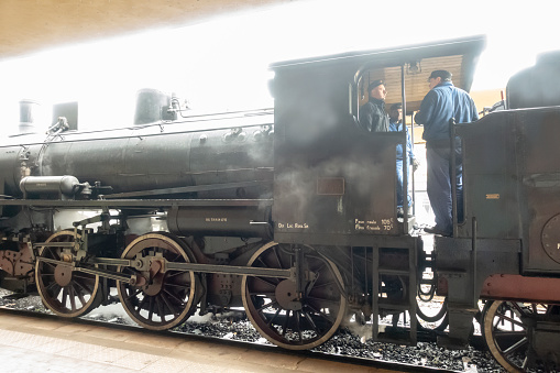 Old Italian restored steam locomotive treno natura,park on the platform. Siena, Italy