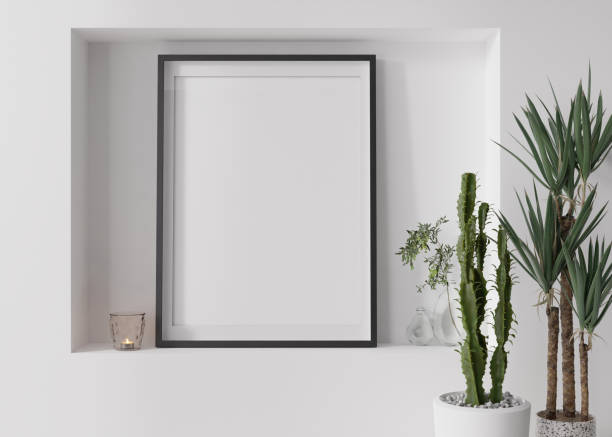 istock Empty vertical picture frame on white wall in modern living room. Mock up interior in contemporary, scandinavian style. Free, copy space for picture. Plants, candle. Close up. 3D rendering. 1395571688